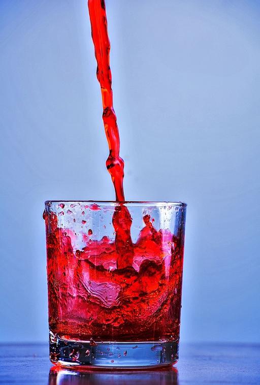 Smooth still red liquid pour